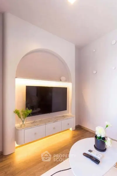 Modern living room with stylish TV unit and ambient lighting