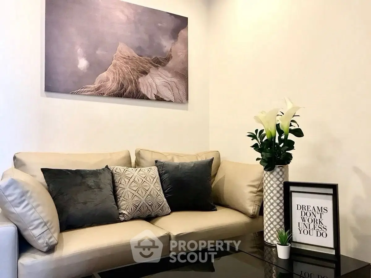 Stylish living room with modern decor, cozy sofa, and elegant artwork for a chic urban lifestyle.