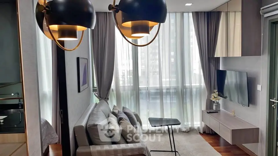 Modern living room with stylish lighting and floor-to-ceiling windows