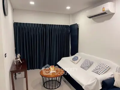 Cozy living room with modern decor and air conditioning