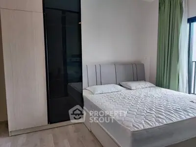 Modern bedroom with sleek wardrobe and comfortable bed in bright apartment