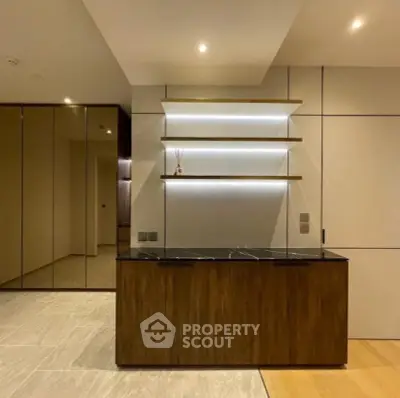 Modern interior with sleek wooden cabinetry and ambient lighting, perfect for stylish living.