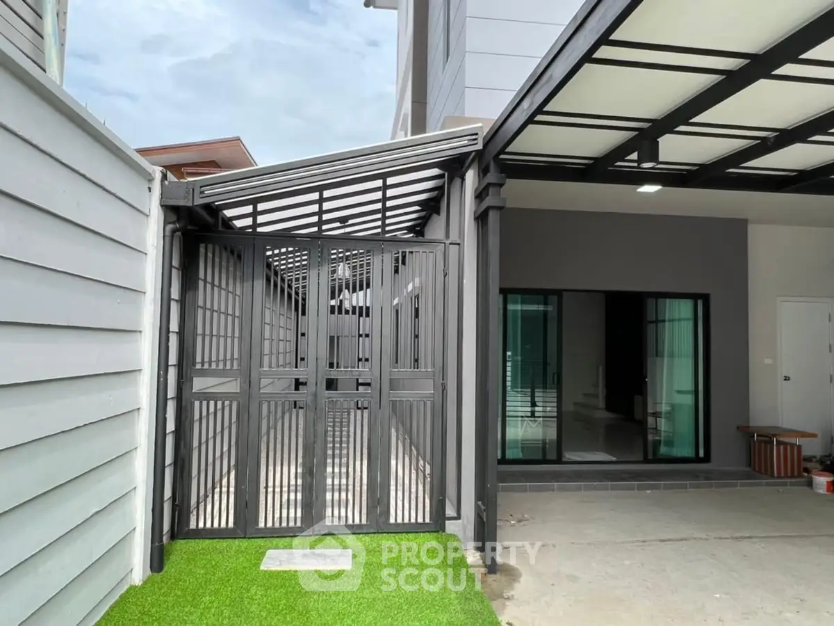 Modern house exterior with sleek design and spacious carport