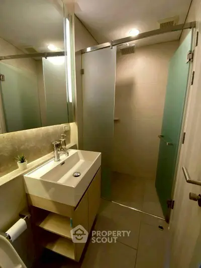 Modern bathroom with sleek design and glass shower enclosure