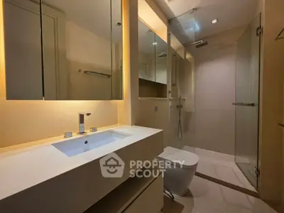 Modern bathroom with sleek design and glass shower enclosure