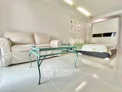 Spacious modern living room with elegant furniture and glossy tiled floors