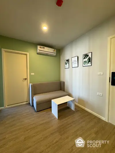 Modern living room with minimalist decor and air conditioning