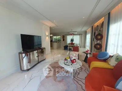 Luxurious living room with modern decor and open layout, featuring elegant furniture and stylish accents.