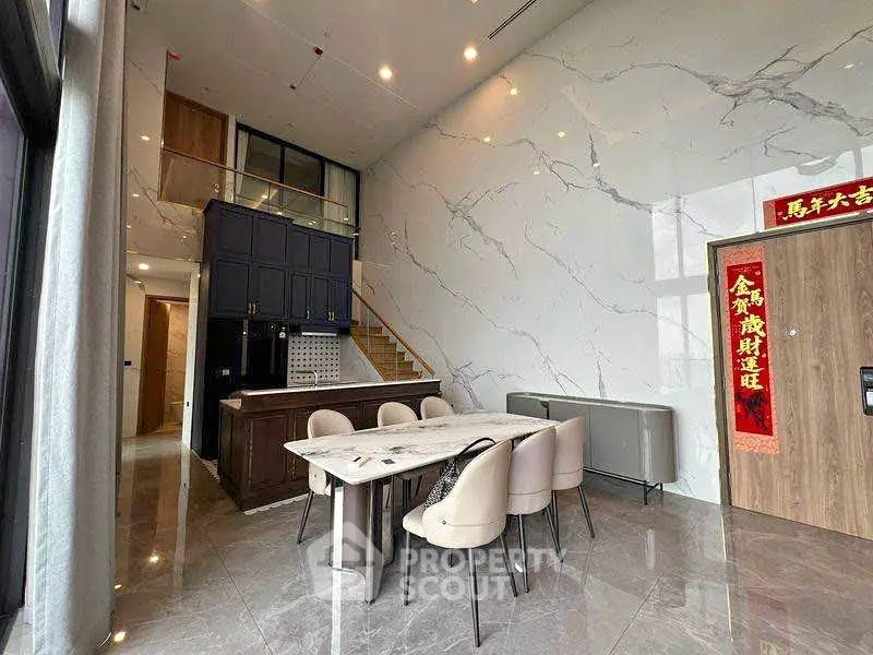 Luxurious modern living room with high ceilings and elegant marble accents