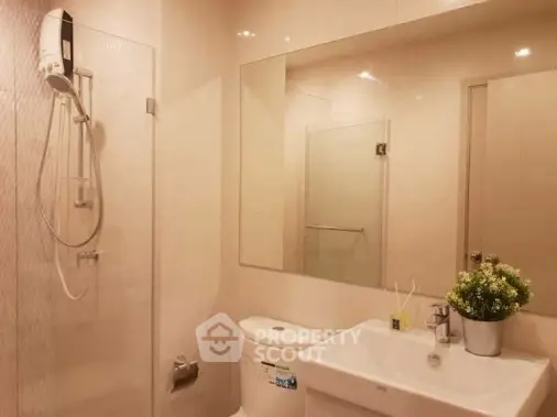 Modern bathroom with sleek shower and elegant sink design