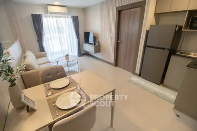 Modern living room with dining area and kitchen in open layout apartment