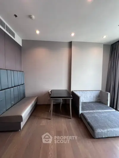 Modern living room with stylish furniture and wooden flooring
