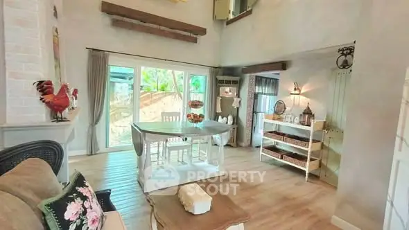 Charming rustic living room with wooden floors and large windows