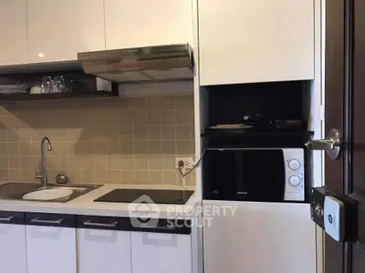 Modern kitchen with sleek cabinetry and built-in appliances