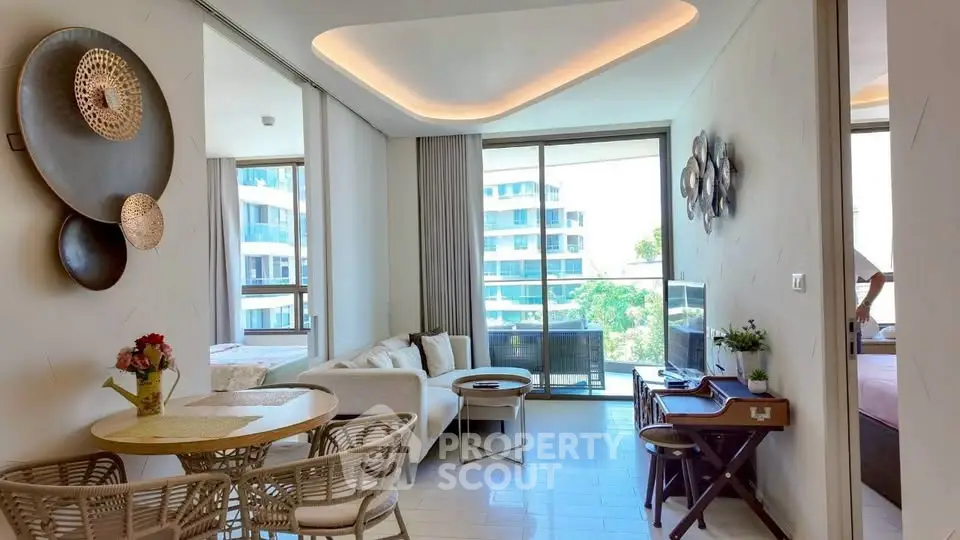Modern living room with stylish decor and large windows offering a bright and airy atmosphere.