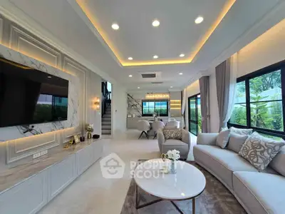 Luxurious modern living room with elegant decor and open layout, featuring a spacious seating area and stylish lighting.