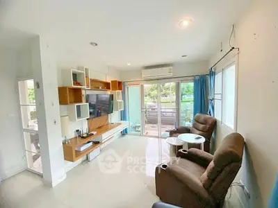 Spacious living room with modern decor and garden view