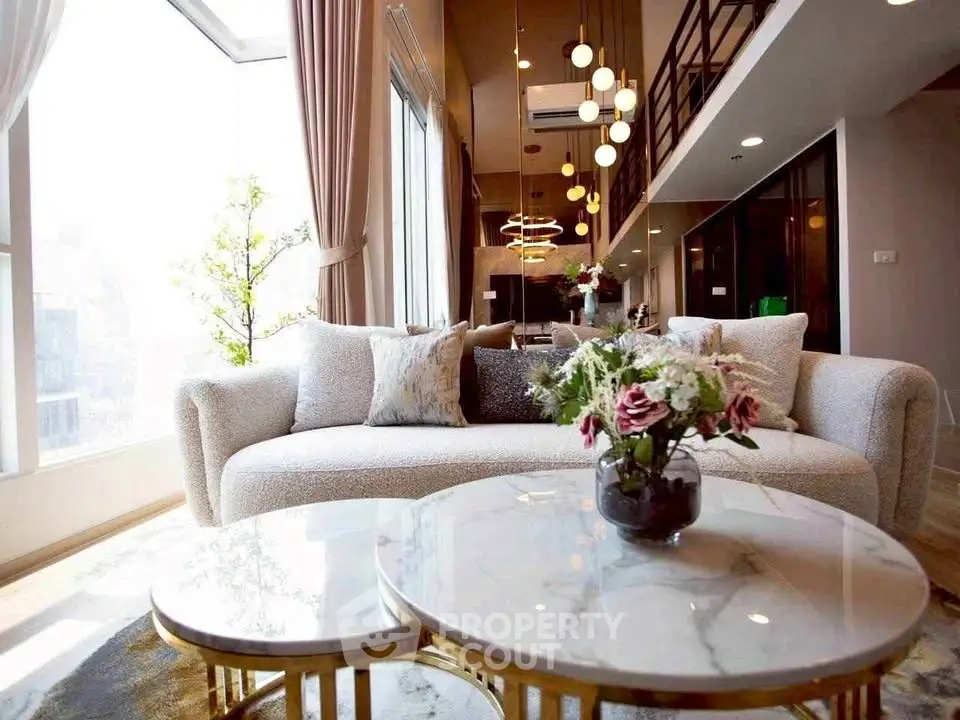 Luxurious modern living room with high ceilings and elegant decor