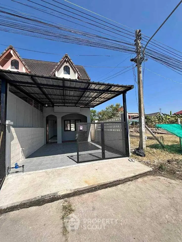 Charming townhouse with covered parking and unique roof design