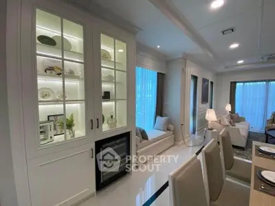Luxurious living room with elegant built-in display cabinet and cozy seating area.