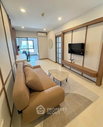 Modern living room with stylish furniture and balcony view