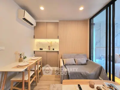 Modern living room with cozy sofa, dining area, and stylish decor in a contemporary apartment.