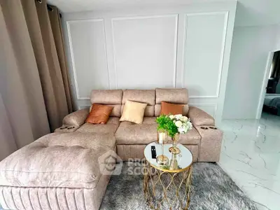 Luxurious living room with plush sofa and elegant decor in modern apartment