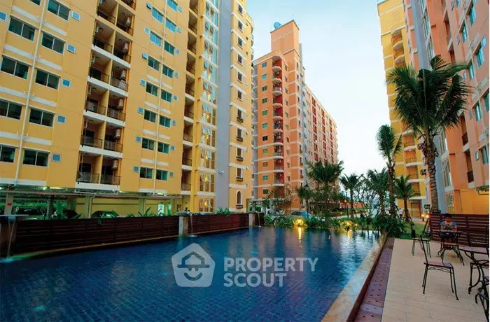 Stunning residential complex with a serene pool and lush landscaping.