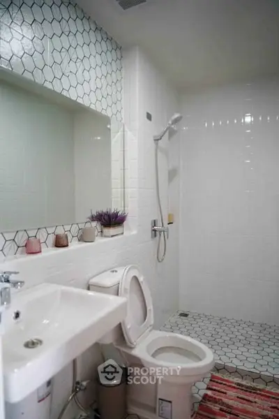 Modern bathroom with hexagonal tiles and sleek fixtures