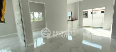 Spacious modern interior with glossy marble floors and abundant natural light.