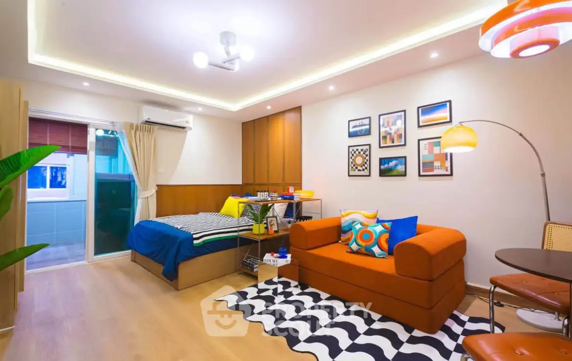 Stylish studio apartment with modern decor and cozy living area