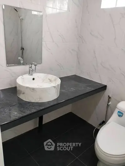 Modern bathroom with marble sink and sleek design