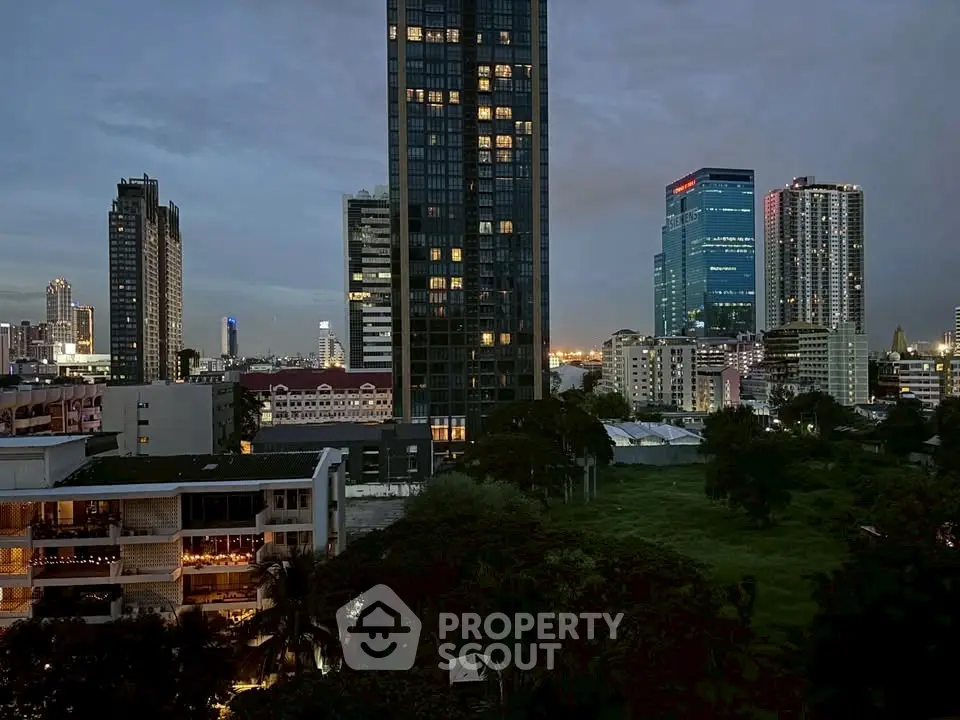 Stunning cityscape view with modern high-rise buildings at dusk, perfect for urban living.