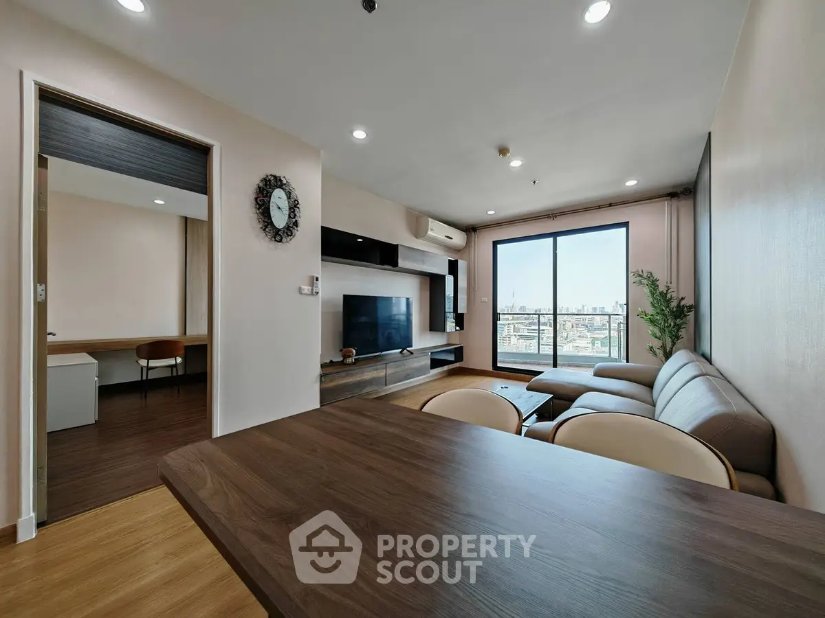 Spacious modern living room with city view and stylish furniture