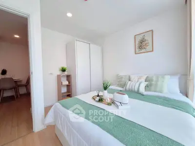 Bright and cozy bedroom with modern decor and green accents