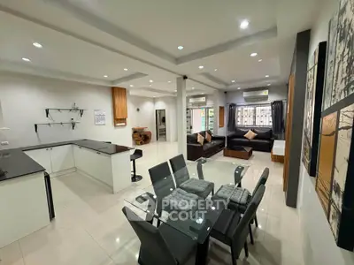 Spacious modern living and dining area with sleek design and open layout