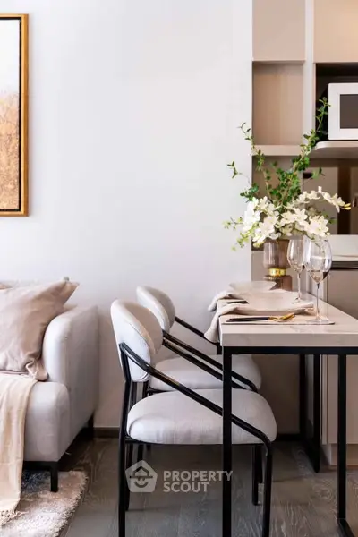 Stylish modern living room with elegant dining area and cozy sofa, perfect for urban living.