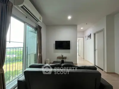 Modern living room with balcony view and sleek furniture