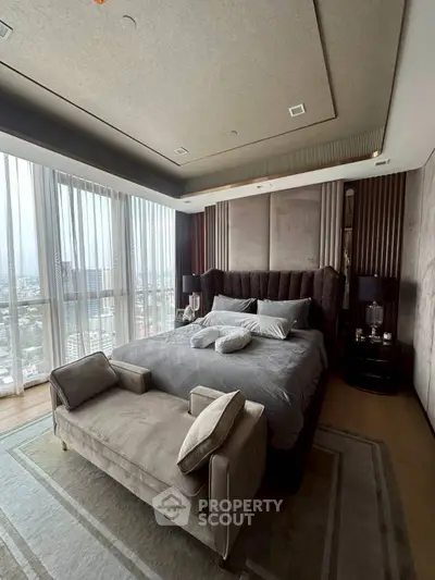Luxurious bedroom with panoramic city view and elegant decor