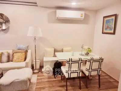 Chic living room with modern decor, cozy seating, and stylish dining area.