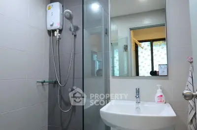 Modern bathroom with glass shower and sleek fixtures