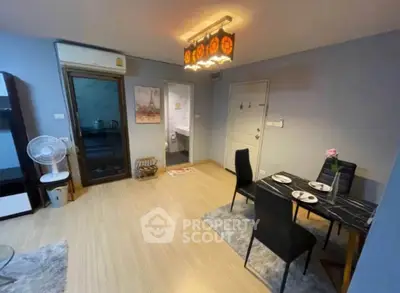 Cozy dining area in modern apartment with stylish decor and wooden flooring