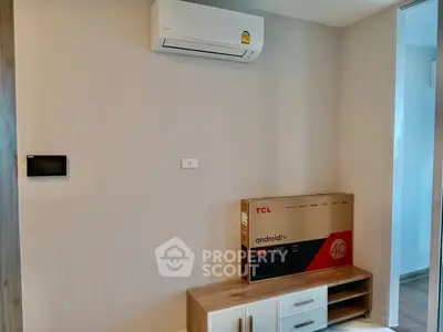 Modern interior with air conditioner and TV stand in a cozy living space.