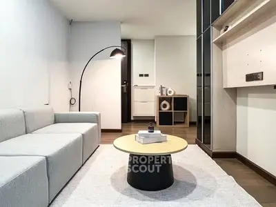 Modern living room with sleek furniture and stylish decor in a contemporary apartment.