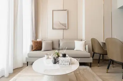 Elegant living room with modern decor and neutral tones