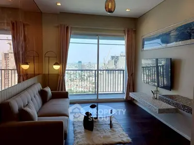Modern living room with large window offering stunning city view, stylish decor, and cozy seating area.