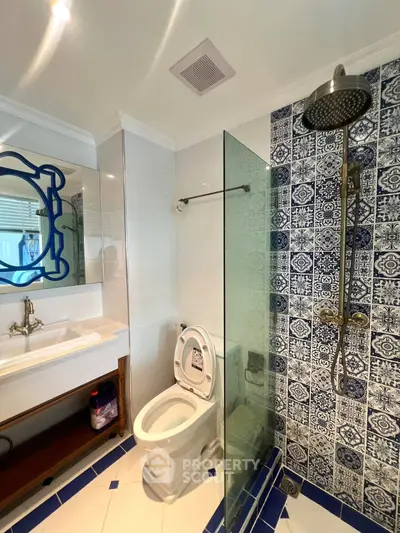 Charming bathroom with stylish blue tile accents and modern fixtures