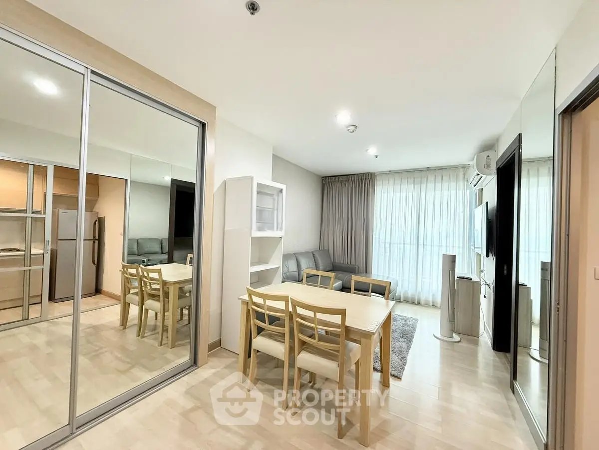 Spacious modern living room with dining area and large windows