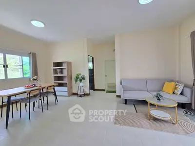 Spacious living room with modern decor and natural light
