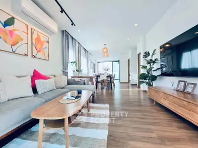 Spacious modern living room with stylish decor and open layout, perfect for relaxation and entertaining.